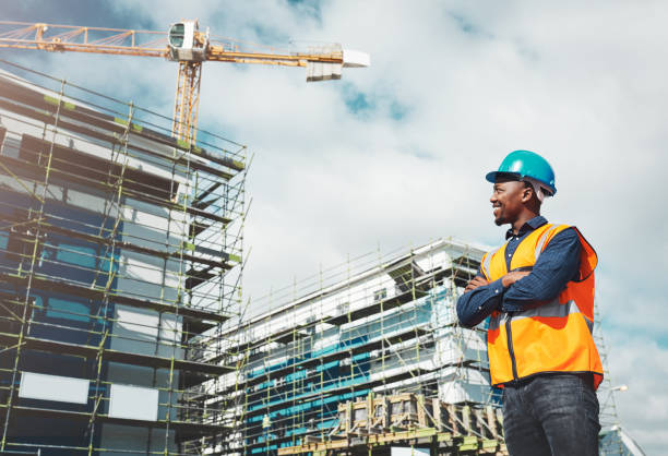 Shot of a confident young man working at a construction site
